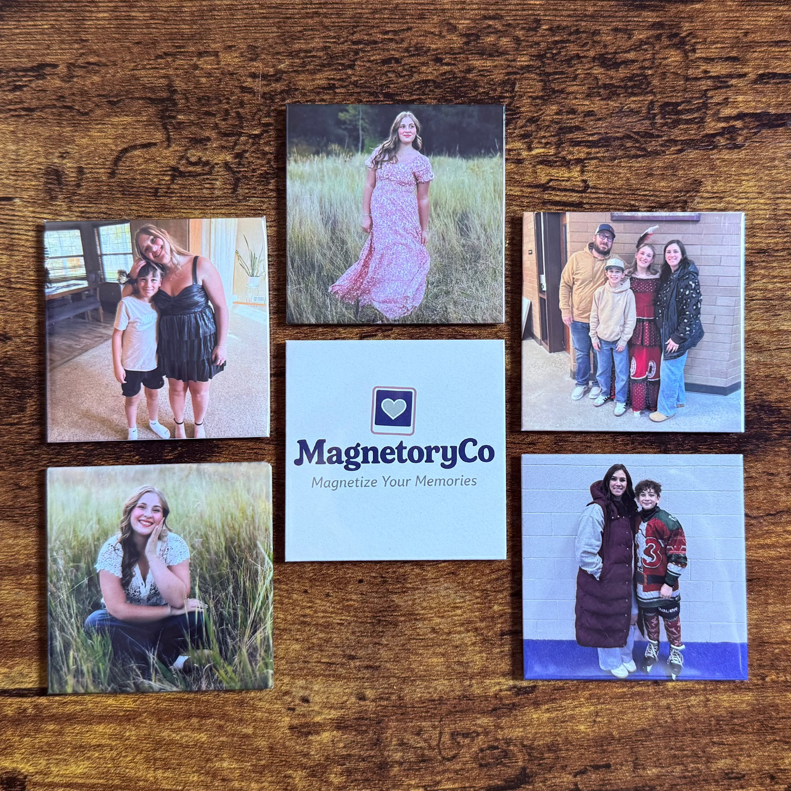 Collection of photo magnets on a wooden surface with 'MagneteryCo' branding.